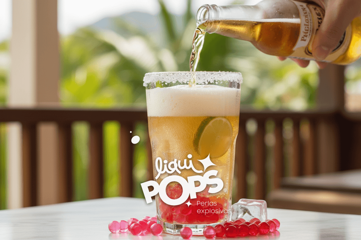 Action shot of cerveza pilsen being poured slowly into a salt-rimmed glass with ice and lime, foam rising, Colombian set.