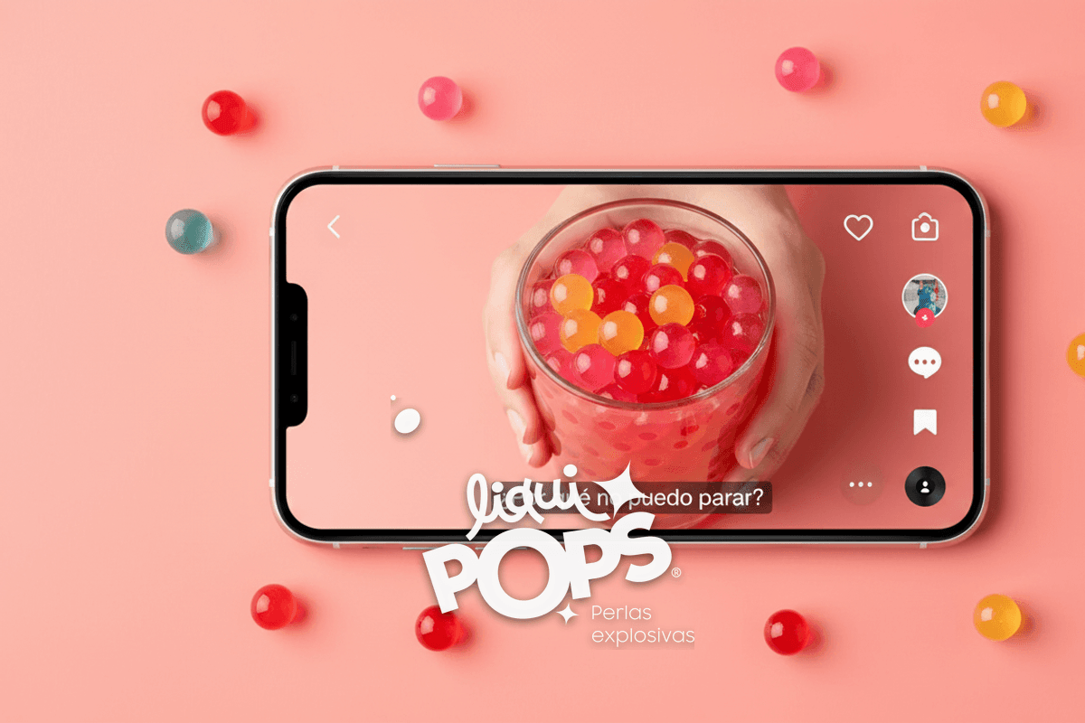 Editorial flatlay of a smartphone showing a TikTok-style video frame on screen: a content creator holding a transparent .